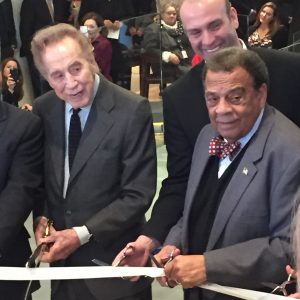 John Portman and Andrew Young, who both have streets named for them at Peachtree Center help cut the ribbon at the grand reopening of 230 Peachtree.